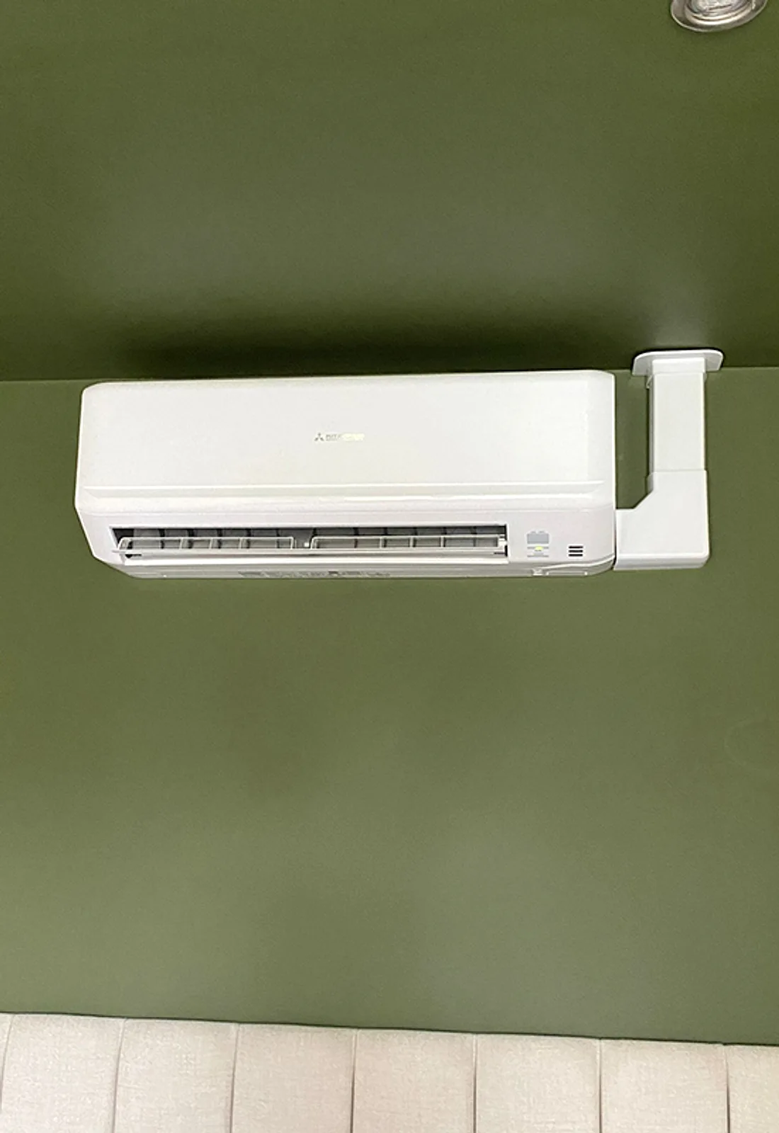 A wall-mounted air-conditioning unit installed by LongLife Heating & Cooling