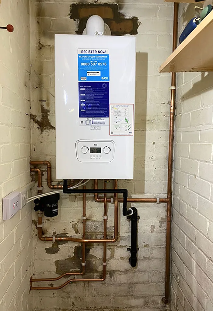 A new combi boiler installed by LongLife with immaculate copper pipework