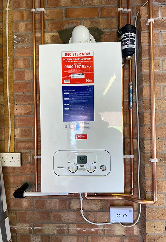 A new combi boiler fitted by LongLife on an exposed brick wall